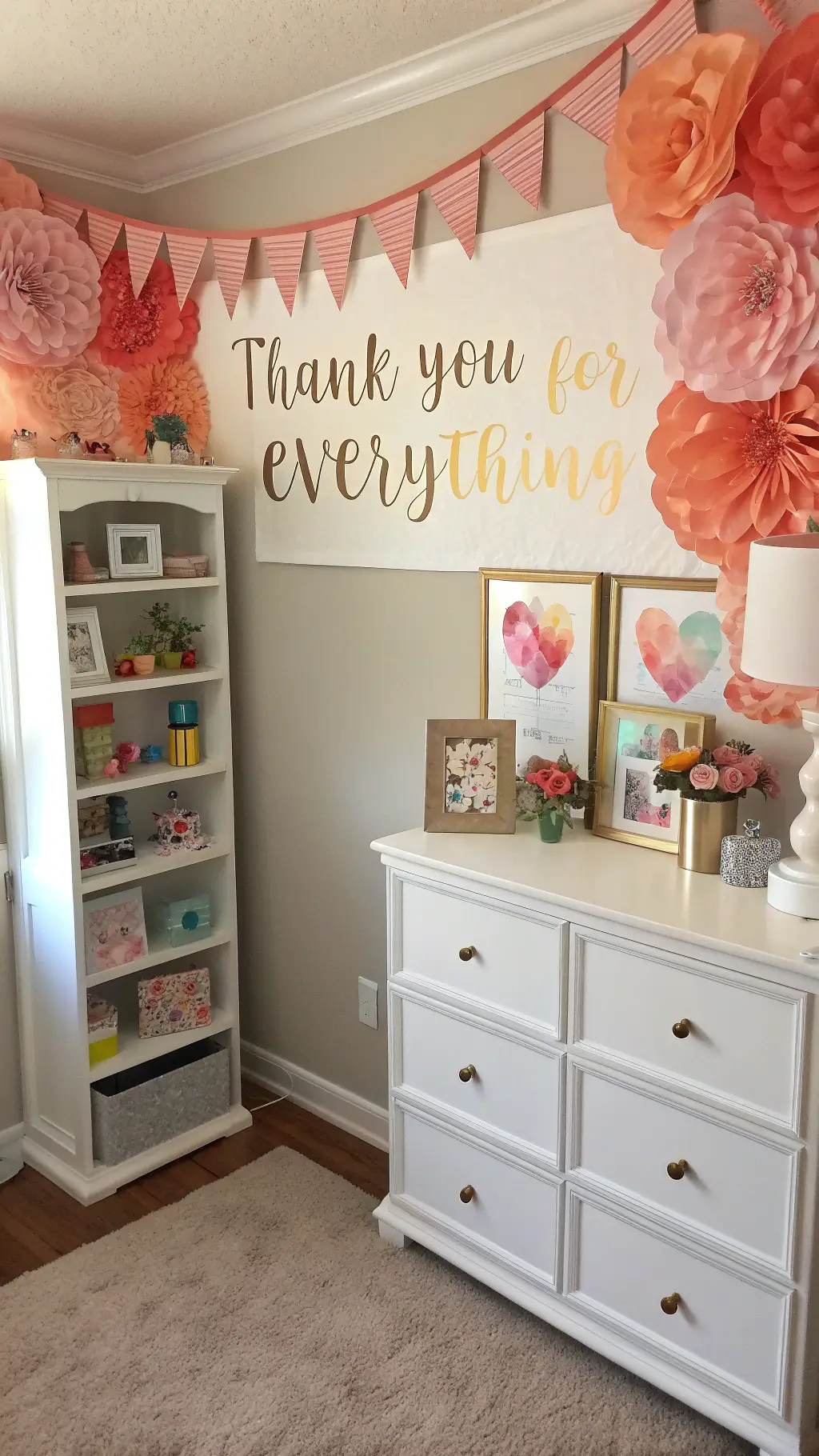 Bloom with Love: A Mother's Day Decor Guide That'll Melt Her Heart 9 Vintage craft room transformed into a celebration space with childhood artwork, DIY pink flower wall, dessert station on a vintage dresser, and 'Thank You for Everything' banner in gold script